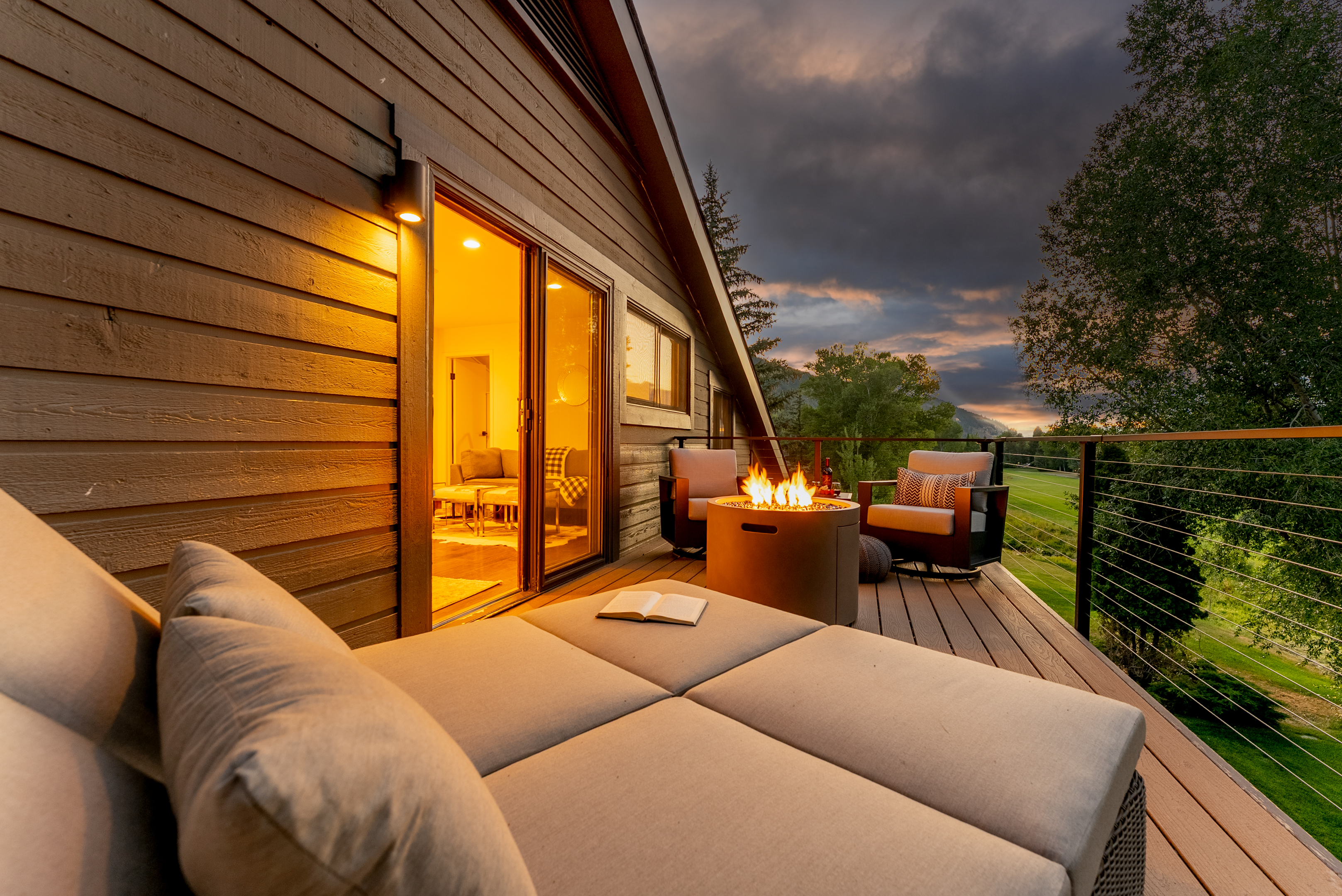 Primary bedroom balcony: Propane outdoor fire pit, seating, mountain views, upper floor