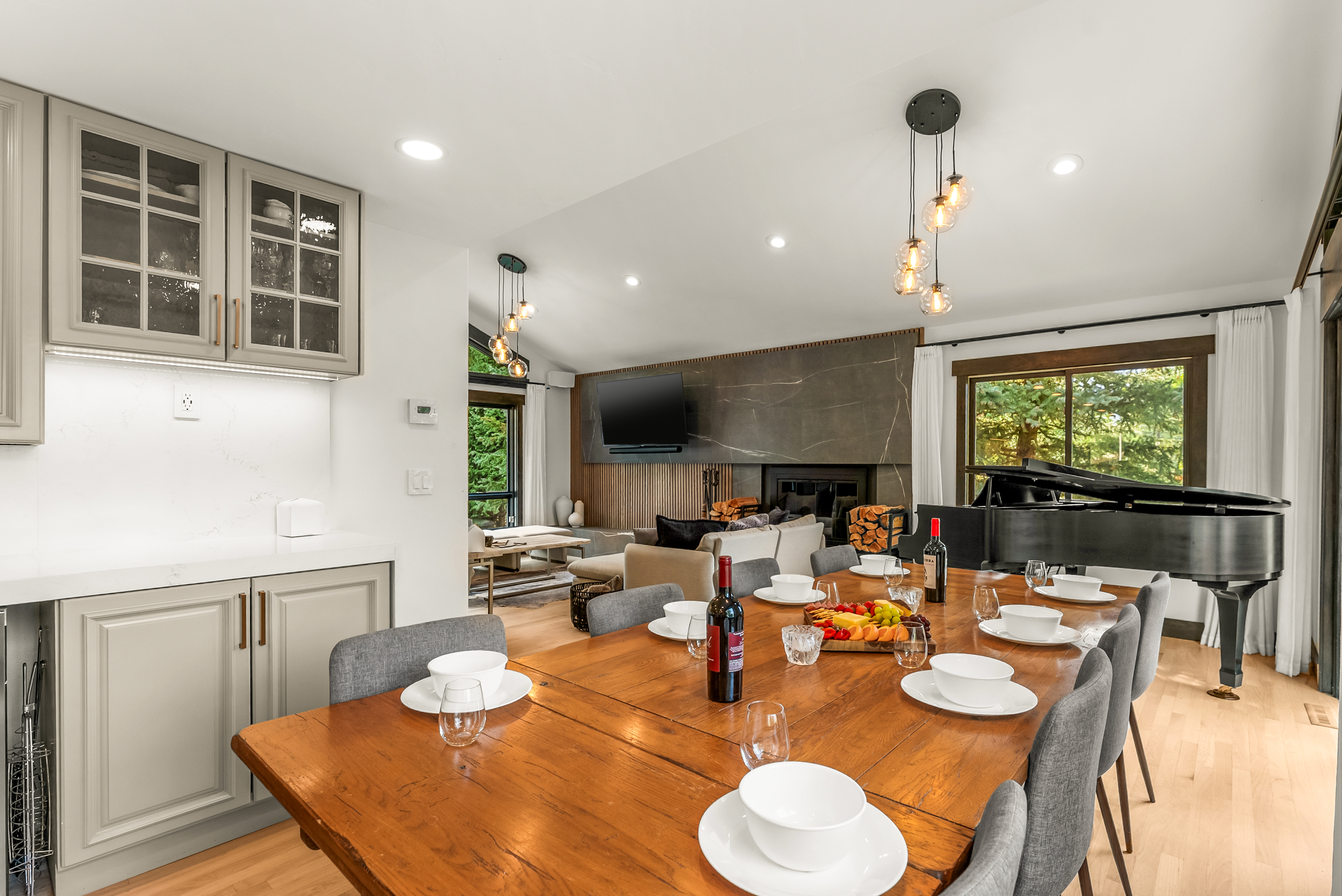 Main floor dining area: 10-seat dining table, 3 barstools