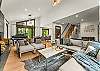 Living room: Wood-burning fireplace, smart TV, Sonos sound system, piano, main floor