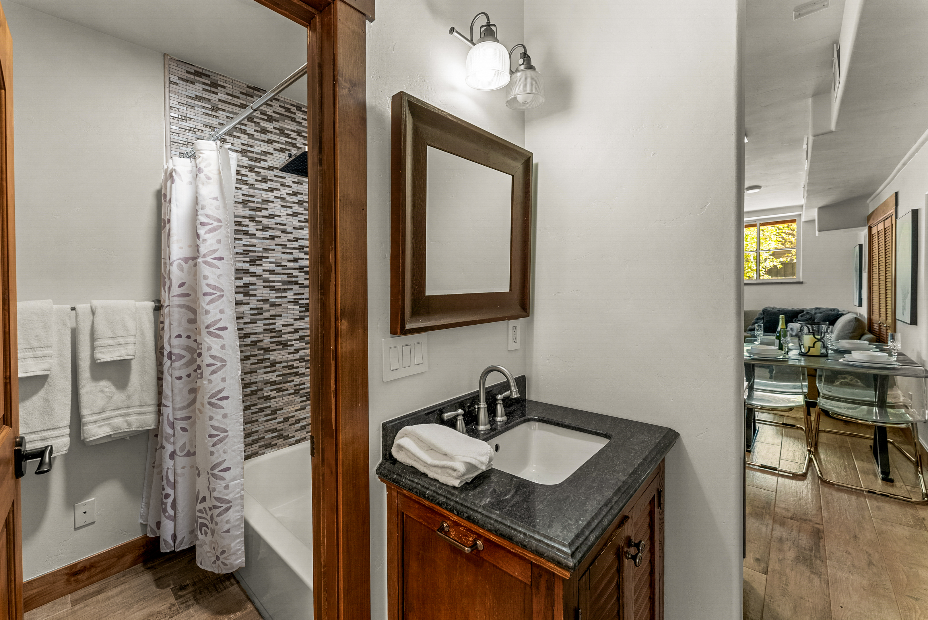 Bathroom 4: Shared bathroom with tub/shower combo, lower floor