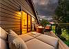 Primary bedroom balcony: Propane outdoor fire pit, seating, mountain views, upper floor