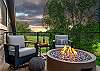 Primary bedroom balcony: Propane outdoor fire pit, seating, mountain views, upper floor