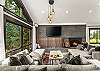Living room: Wood-burning fireplace, smart TV, Sonos sound system, piano, main floor