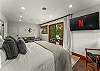 Bedroom 1: California king bed, walk-in closet, couch, private balcony, en-suite bathroom, upper floor