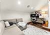 Dedicated workspace, smart TV with HDMI cable, printer, and sleeper sofa
