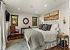Bedroom 1: California king bed, walk-in closet, couch, private balcony, en-suite bathroom, upper floor