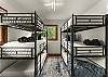 Bedroom 6: 2 sets of triple twin bunk beds, upper floor