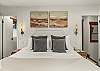 Bedroom 1: California king bed, walk-in closet, couch, private balcony, en-suite bathroom, upper floor