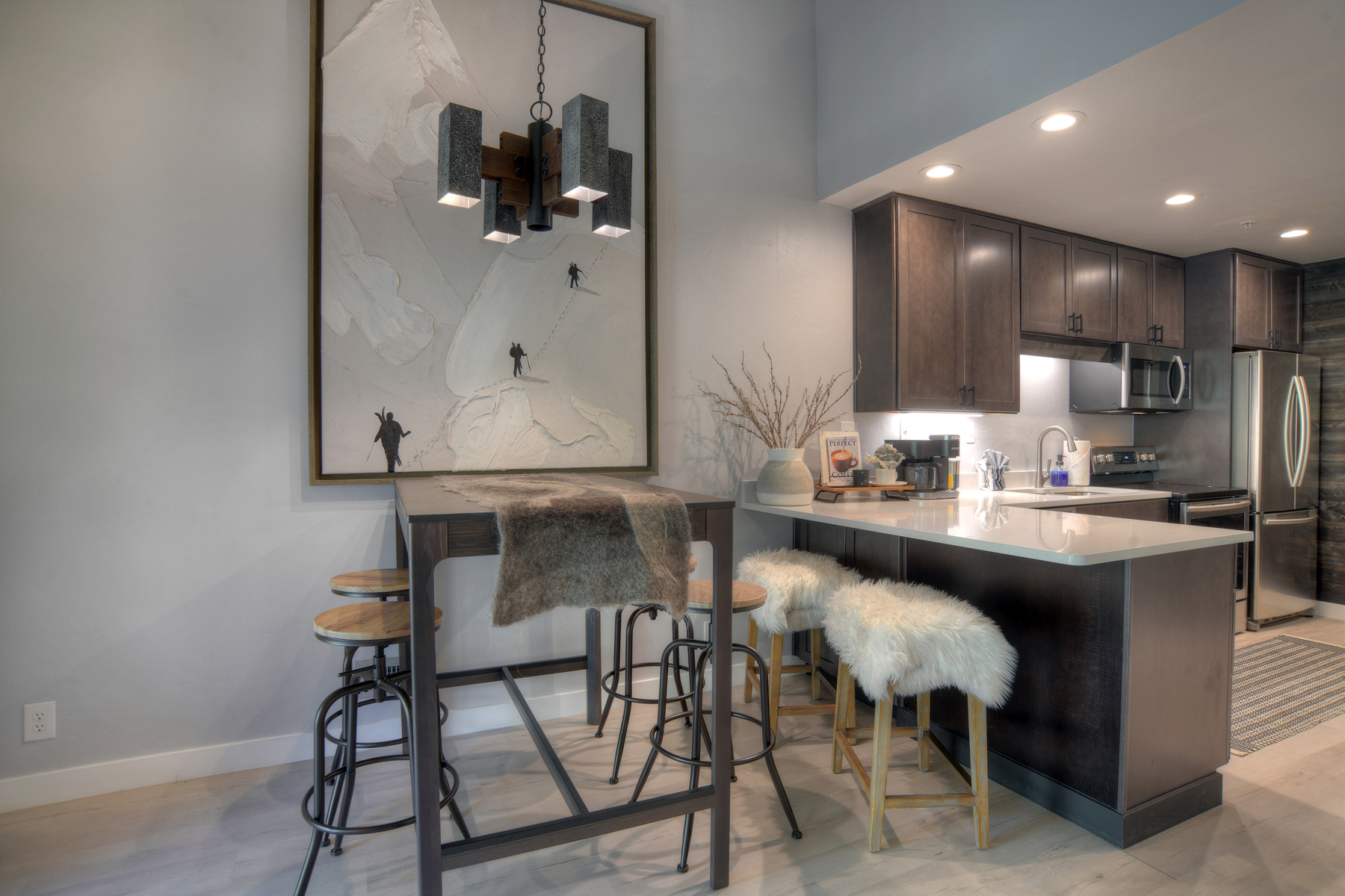 Gather comfortably with dining space for 4 guests and breakfast bar seating for 2. 