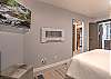 Relax and recharge in this cozy queen bedroom retreat – includes electric fireplace and Smart TV. 