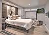 Relax and recharge in this cozy queen bedroom retreat – includes electric fireplace and Smart TV. 