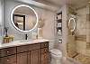 Full bathroom featuring a sleek walk-in shower.