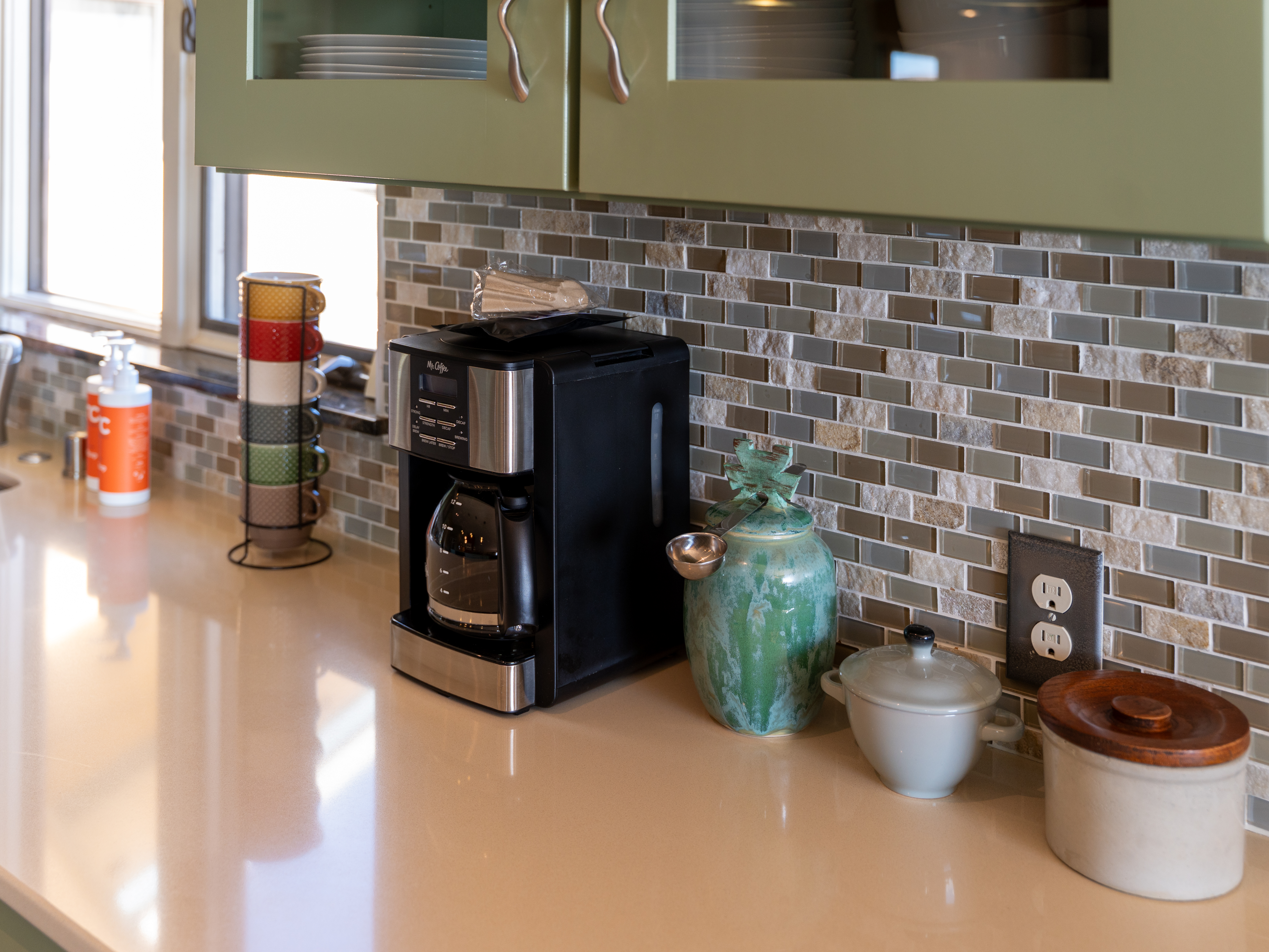 Gourmet kitchen with stainless steel appliances and breakfast bar.