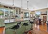 Gourmet kitchen with stainless steel appliances and breakfast bar.