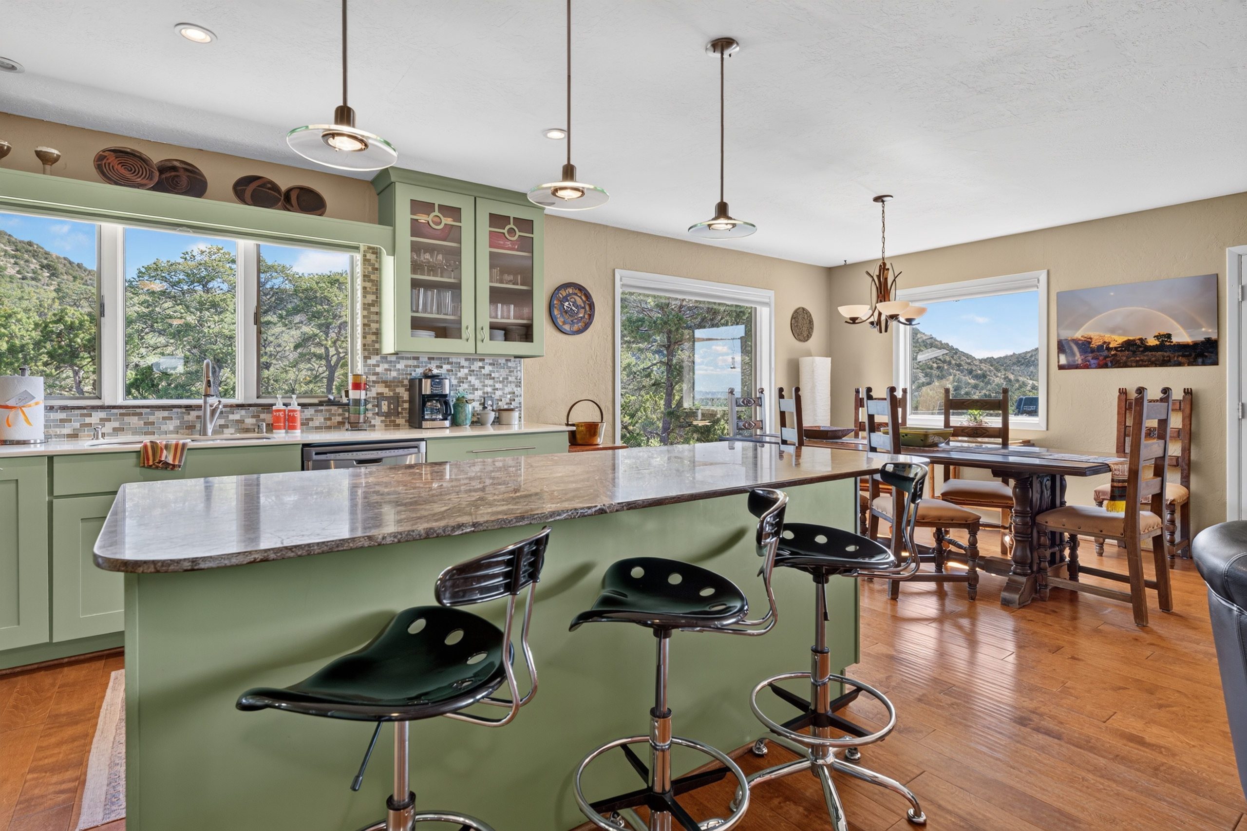Gourmet kitchen with stainless steel appliances and breakfast bar.