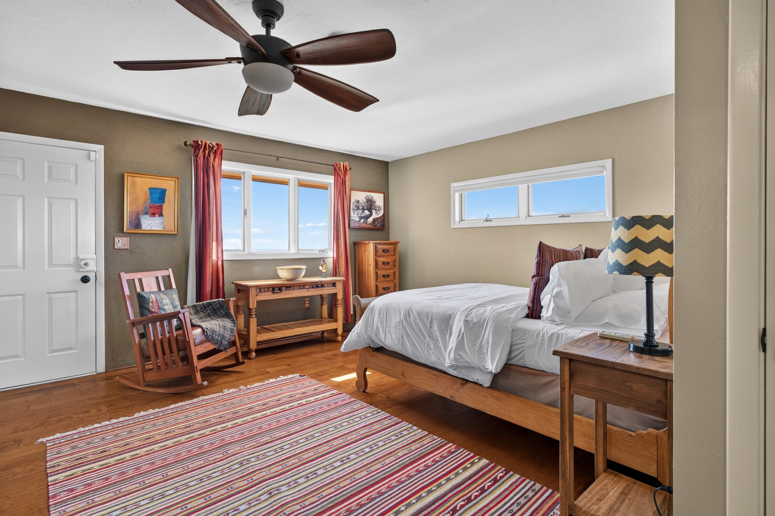 Main King bedroom with en suite bathroom and private deck access.