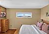 Bedroom 1: Queen Bed with ensuite bathroom and private deck access (Main Level).