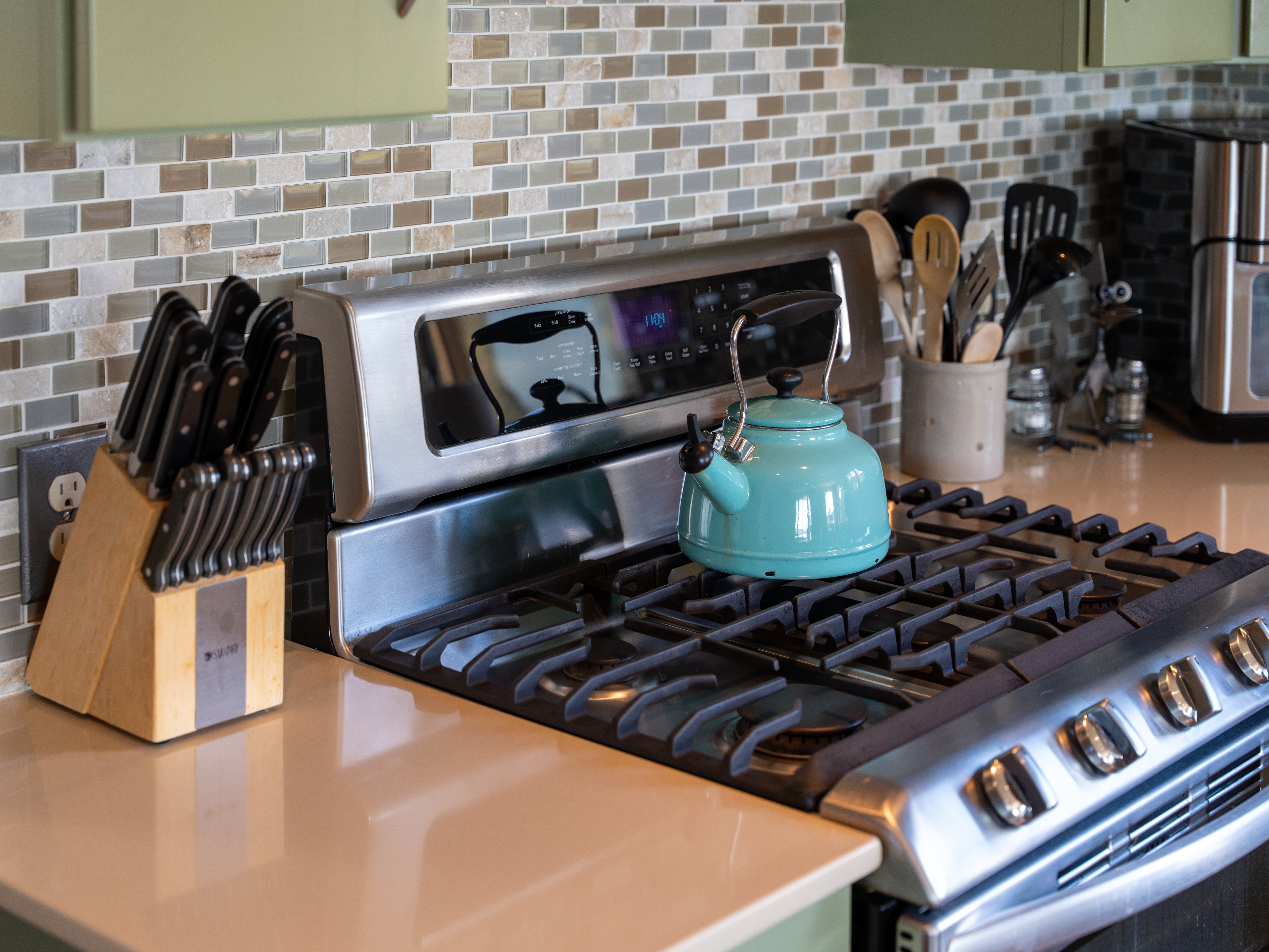 Gourmet kitchen with stainless steel appliances and breakfast bar.