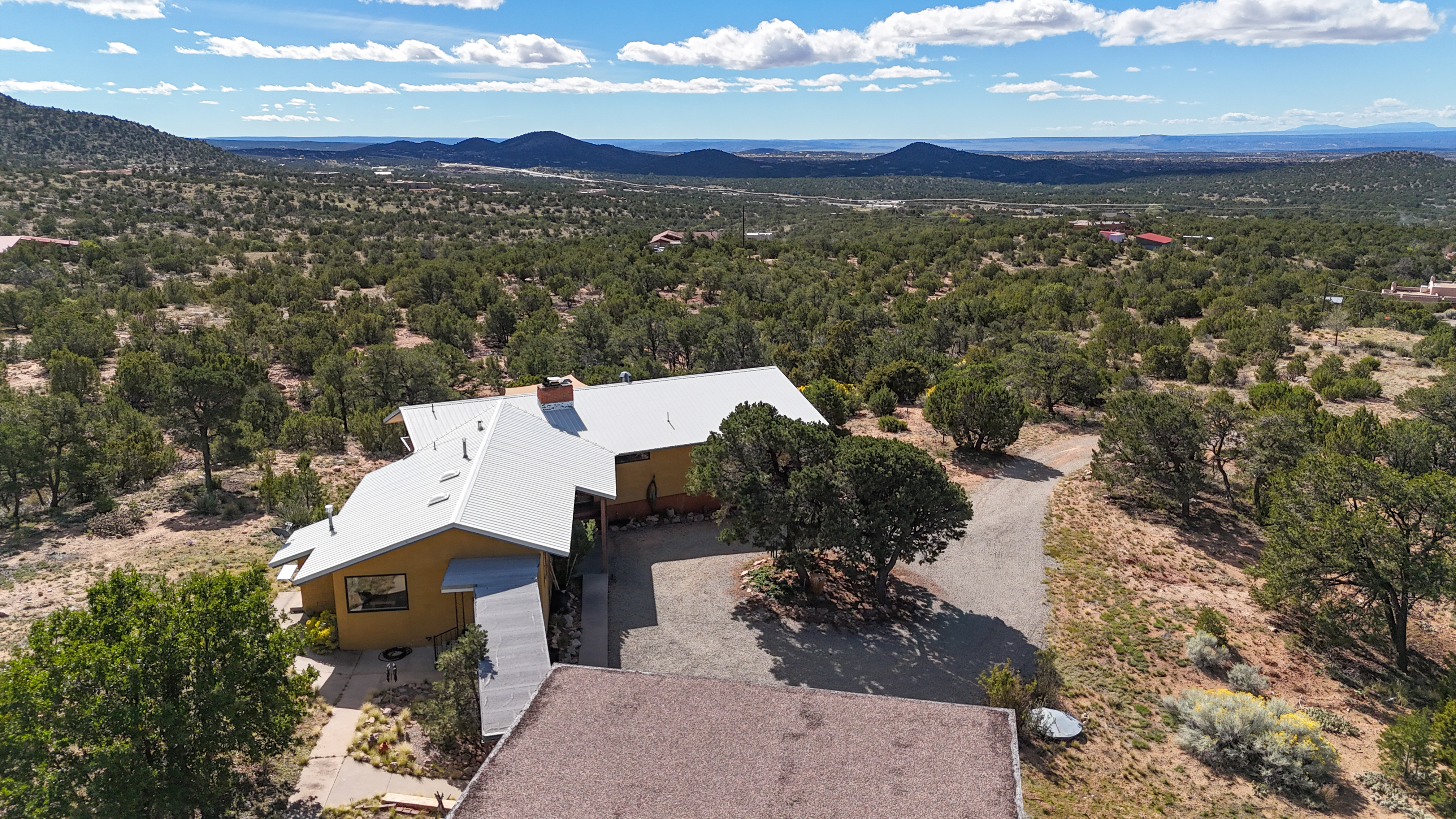 The home is surrounded by mountain views.