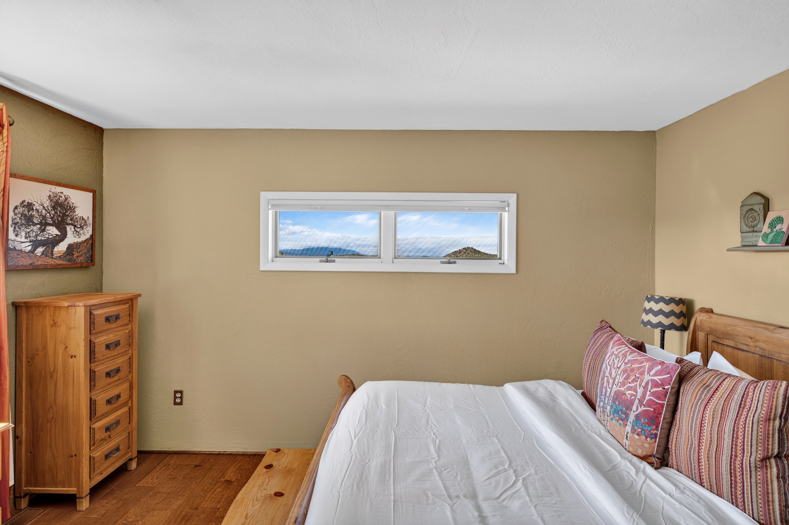 Main King bedroom with en suite bathroom and private deck access.