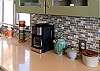 Gourmet kitchen with stainless steel appliances and breakfast bar.