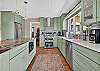 Gourmet kitchen with stainless steel appliances and breakfast bar.