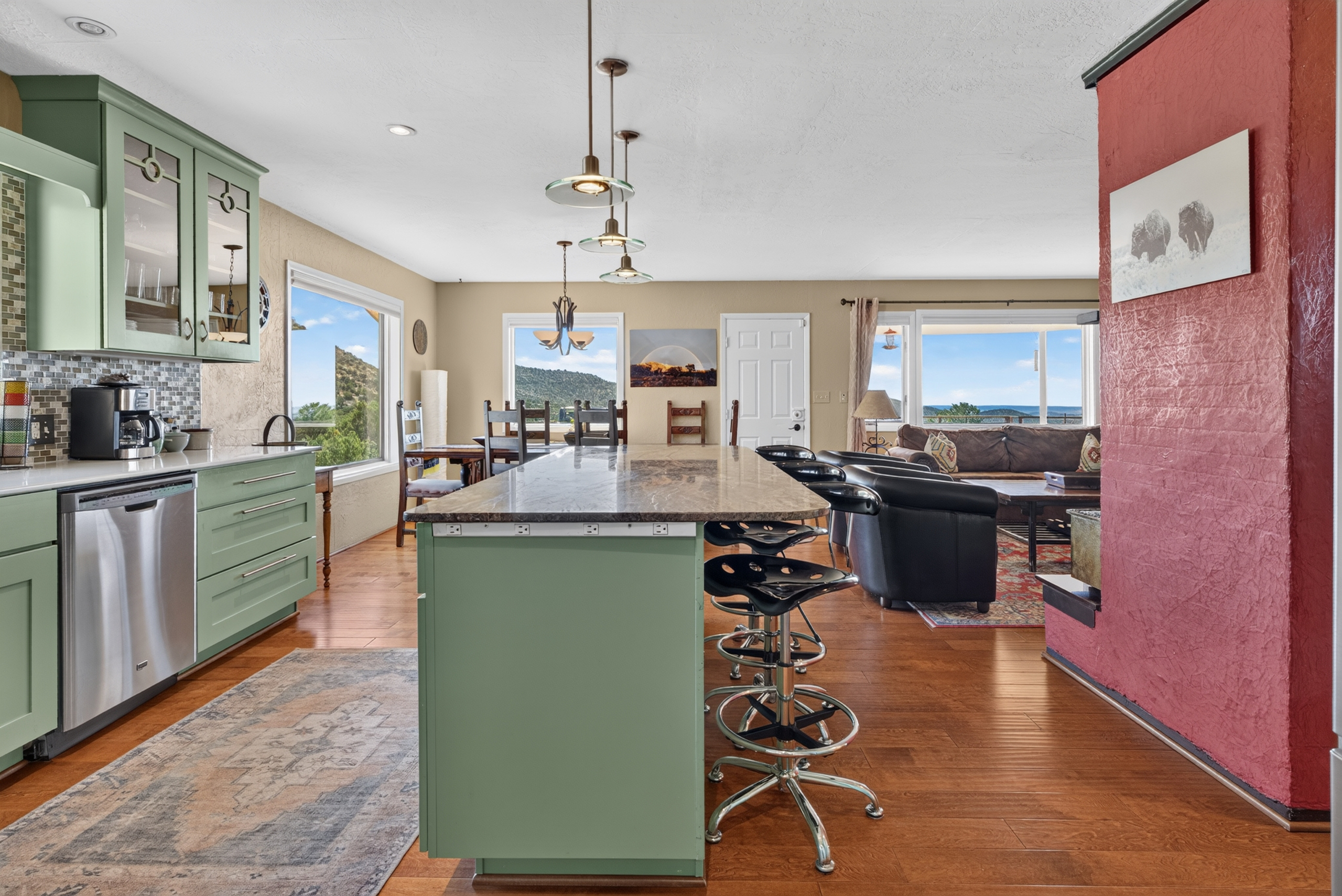 Gourmet kitchen with stainless steel appliances and breakfast bar.