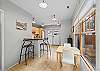 Gather comfortably with dining space for 2 guests and additional breakfast bar seating.