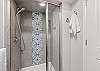 Full bathroom featuring a sleek walk-in shower.
