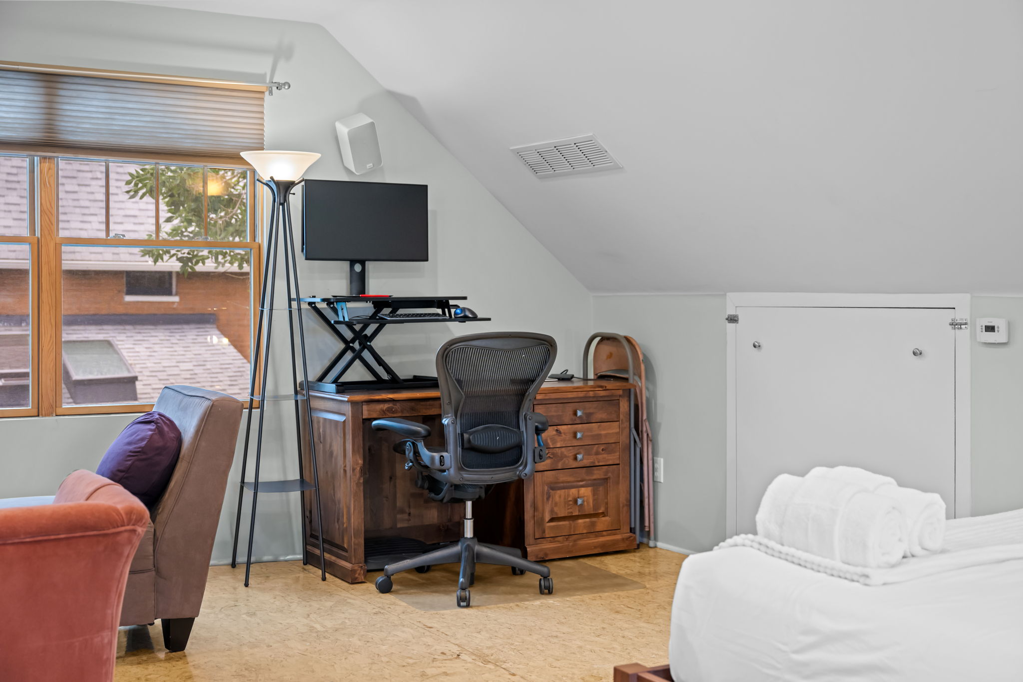 Desk space available for remote work in the bedroom. 
