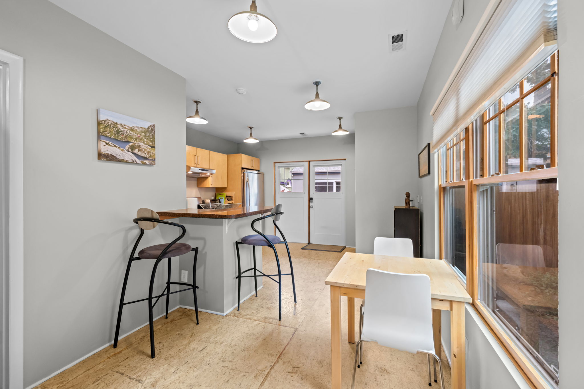 Gather comfortably with dining space for 2 guests and additional breakfast bar seating.