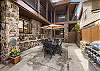 Lower courtyard with propane grill and outdoor seating