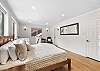 Primary ensuite bedroom with one king bed and private full bathroom – located on upper level (3rd floor).