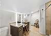 Primary ensuite bathroom featuring a sleek walk-in shower and vanity.