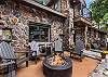 Front Outdoor Lounge Space with Adirondack Chairs and Propane Fire pit. 