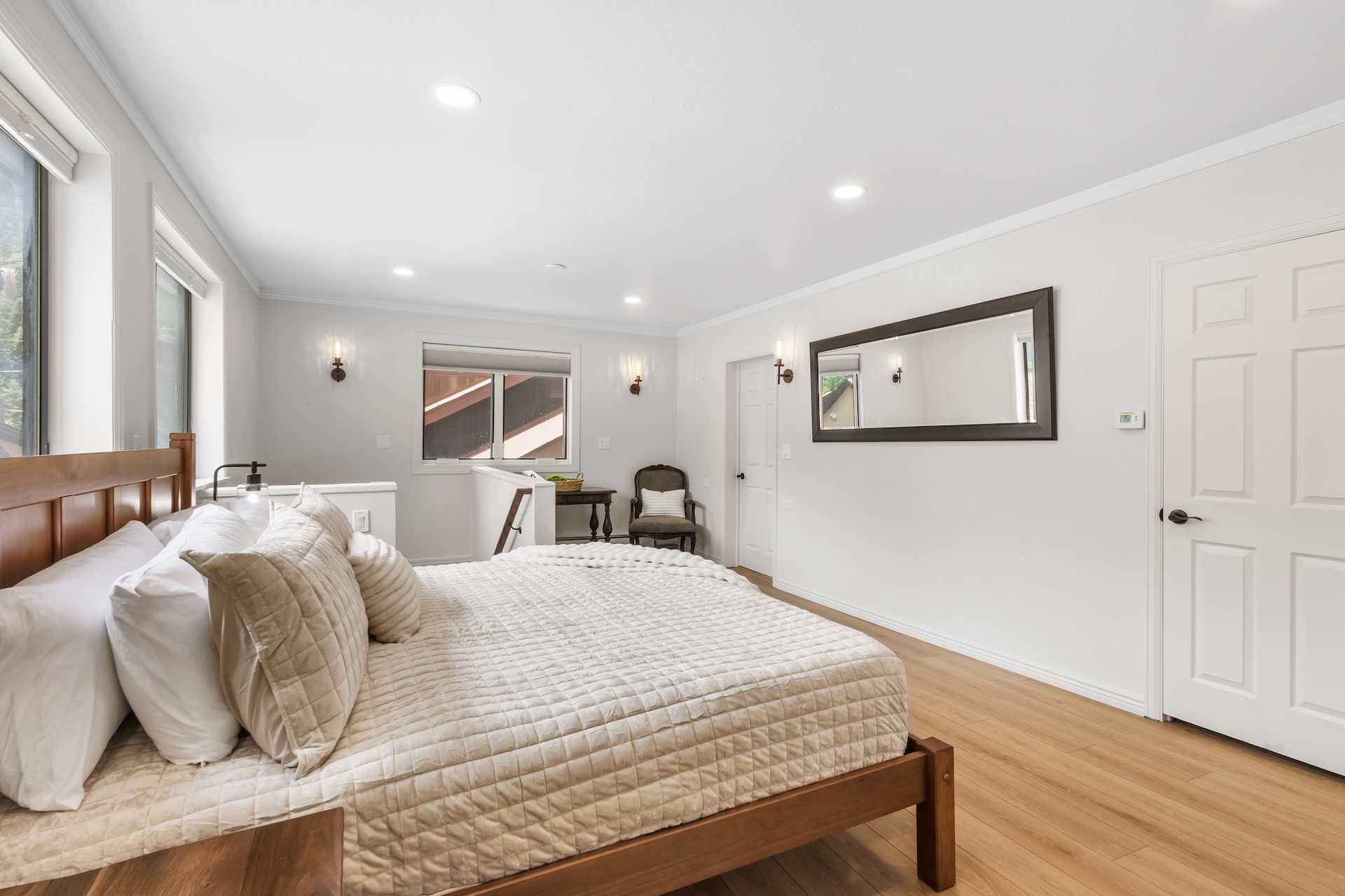 Primary ensuite bedroom with one king bed and private full bathroom – located on upper level (3rd floor).