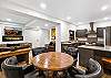 Living room area and kitchen/dining area #2  – located on the lower level (first floor).