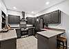 Kitchen #2 with dining seating for 4 – located on the lower level (first floor).