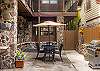 Lower courtyard with propane grill and outdoor seating
