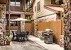 Lower courtyard with propane grill and outdoor seating
