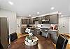 Fully equipped kitchen and a dining table that seats 6.