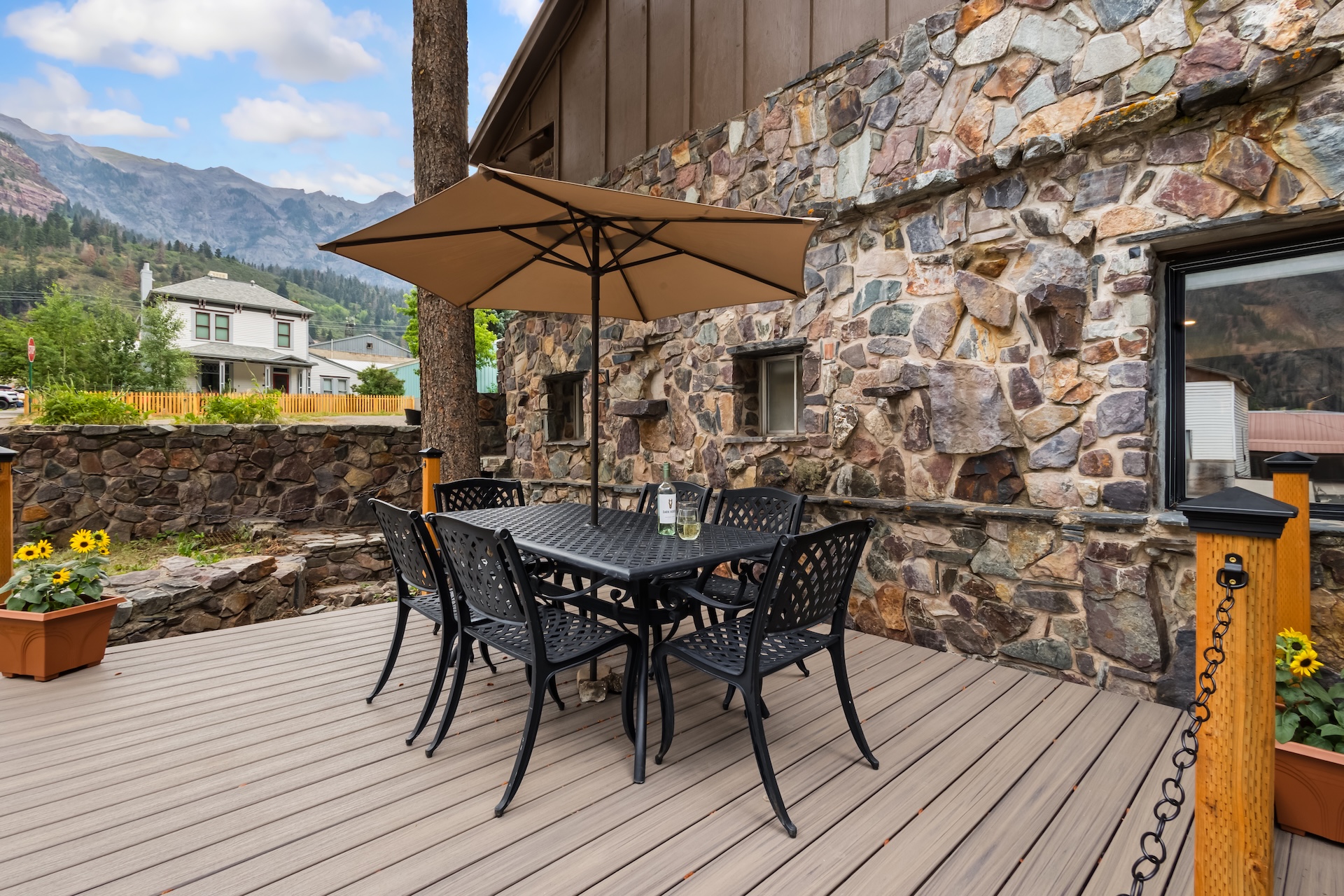 Lower side deck with outdoor dining space for 6 and mountain views.