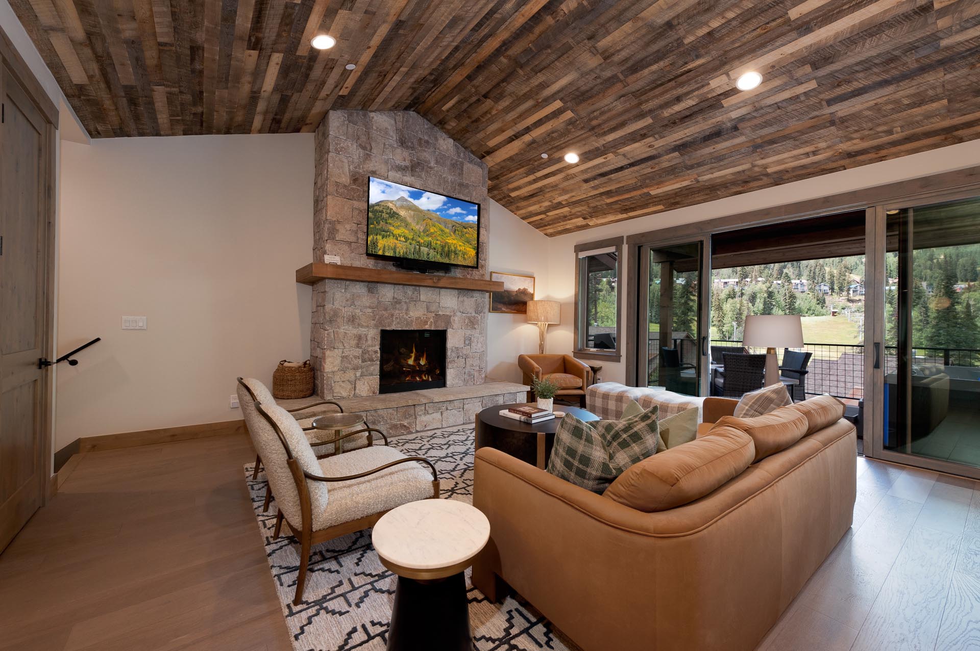 Main Living Space- Gas Fireplace, TV and Deck
