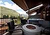 Deck off the Main Living Space with a private hot tub, gas firepit and a BBQ.