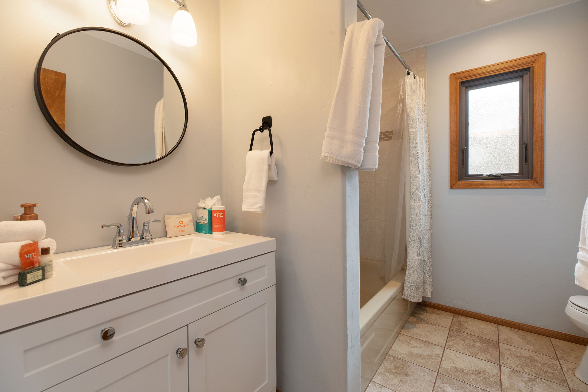 Full bathroom with tub/shower combo. 