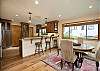 Gather comfortably with dining space for 4 guests + breakfast bar seating for 3.