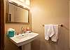 Conveniently located half bath with sink and toilet