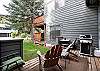 Back patio with outdoor seating and grill.
