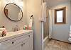 Full bathroom with tub/shower combo. 