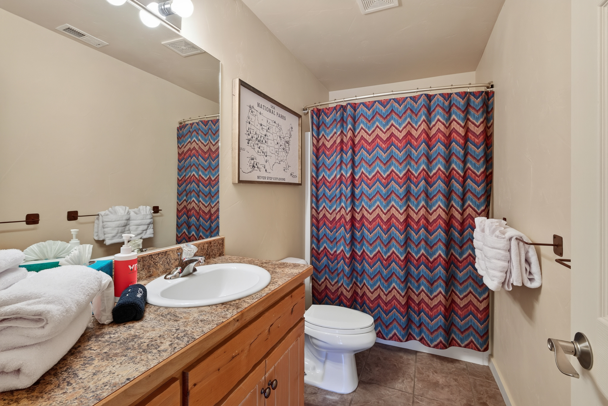 The guest bathroom features a convenient tub/shower combo.